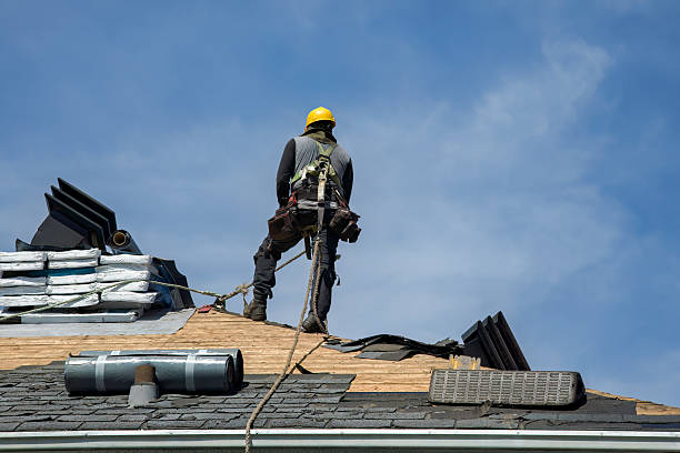 Professional Roofing technician working in Roslyn, NY